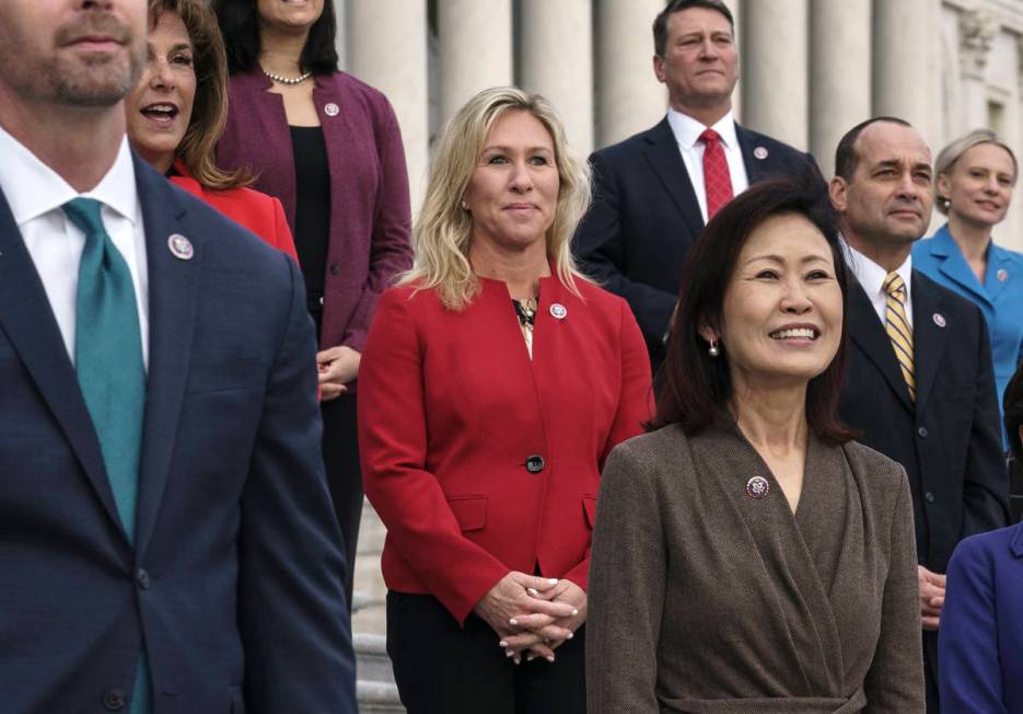 In this Jan. 4, 2021, photo, Rep. Marjorie Taylor Greene, R-Ga., center, stands with other GOP ...