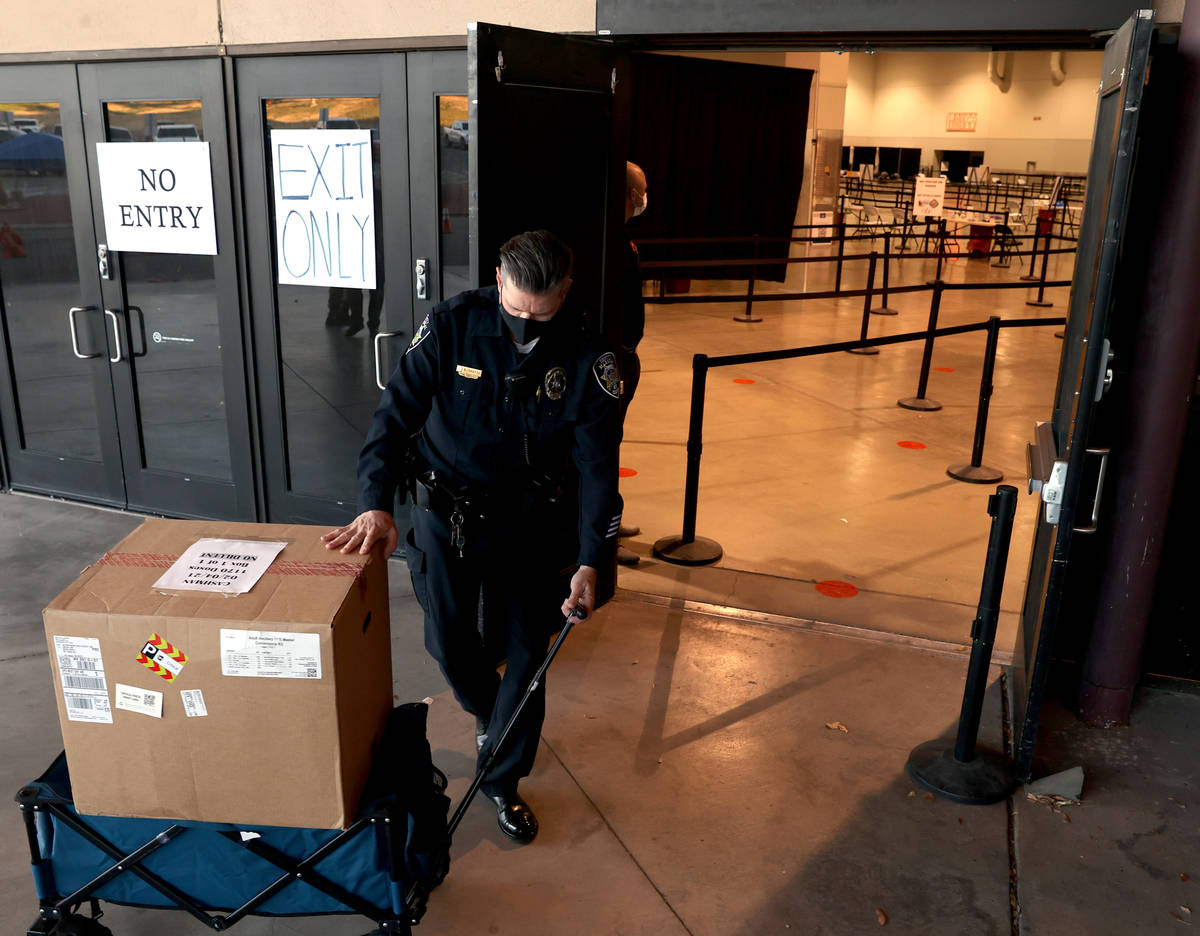 City of Las Vegas Deputy Marshal Shawn Thatch transports Pfizer vaccine and ancillary kit at th ...