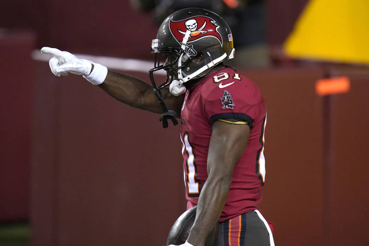 Tampa Bay Buccaneers wide receiver Antonio Brown gestures after catching a touchdown pass from ...
