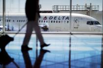 In this Oct. 13, 2016, file photo, a Delta Air Lines jet sits at a gate at Hartsfield-Jackson A ...