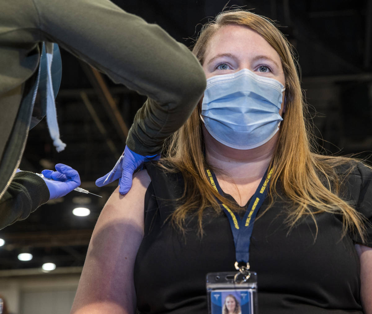 Jessica Johnson is injected with the Moderna vaccine at the Southern Nevada Health District&#xd ...