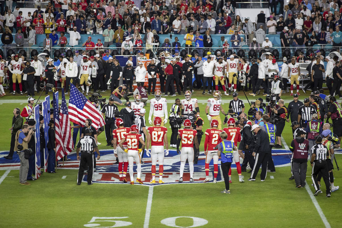 The San Francisco 49ers and Kansas City Chiefs' captains participate in the coin toss before Su ...