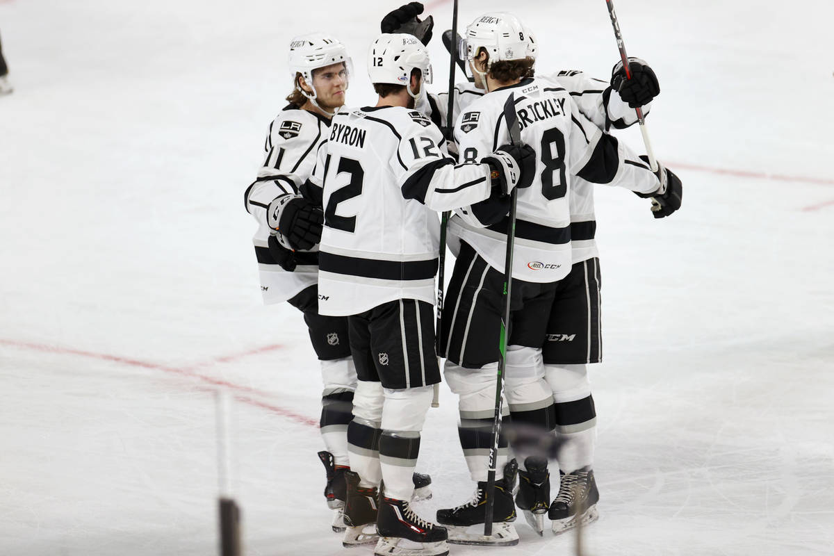 Ontario Reign Daniel Brickley (8) celebrates a score with his team during the first period of a ...
