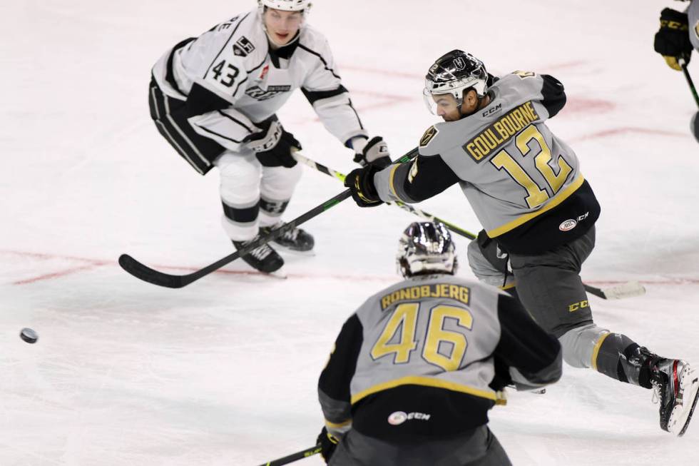 Henderson Silver Knights forward Tyrell Goulborne (12) takes a shot at the goal as Ontario Reig ...