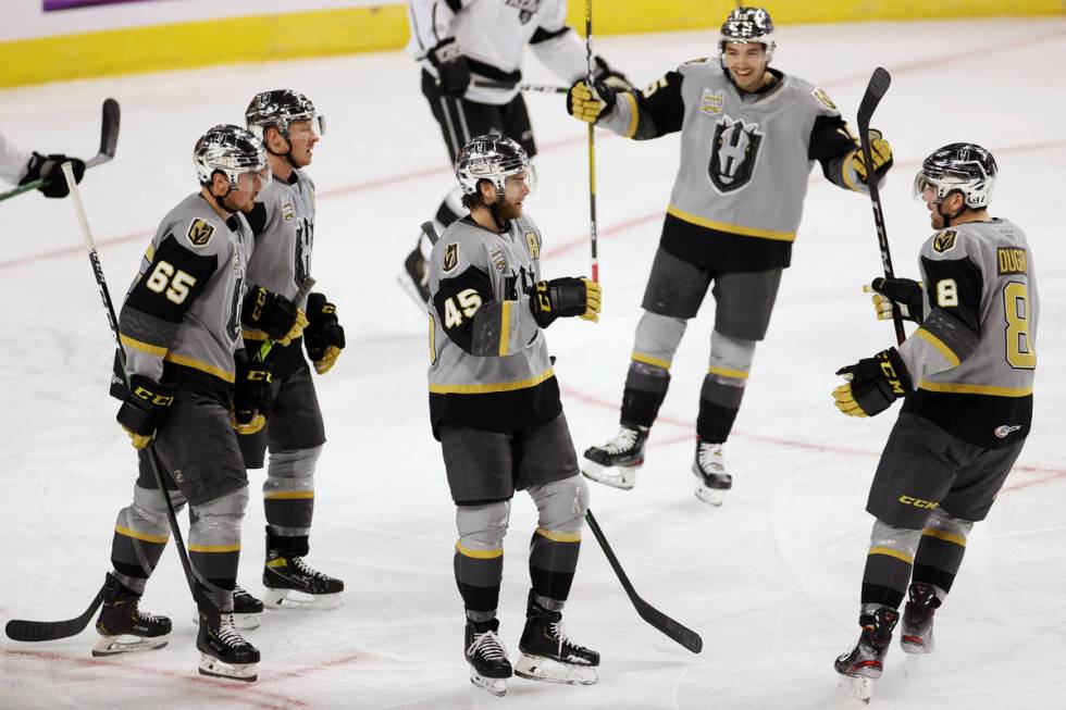 Henderson Silver Knights defenseman Jake Bischoff (45) celebrates a goal with his team during t ...