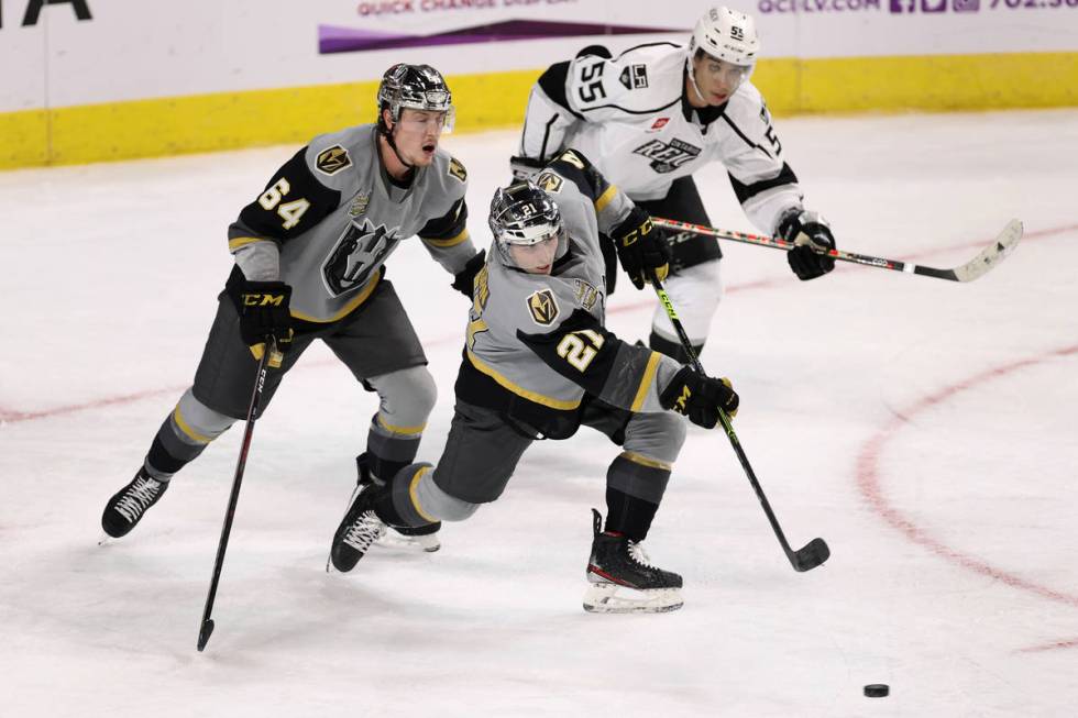 Henderson Silver Knights forward Danny O'Regan (21) shoots for an empty net goal as teammate Be ...