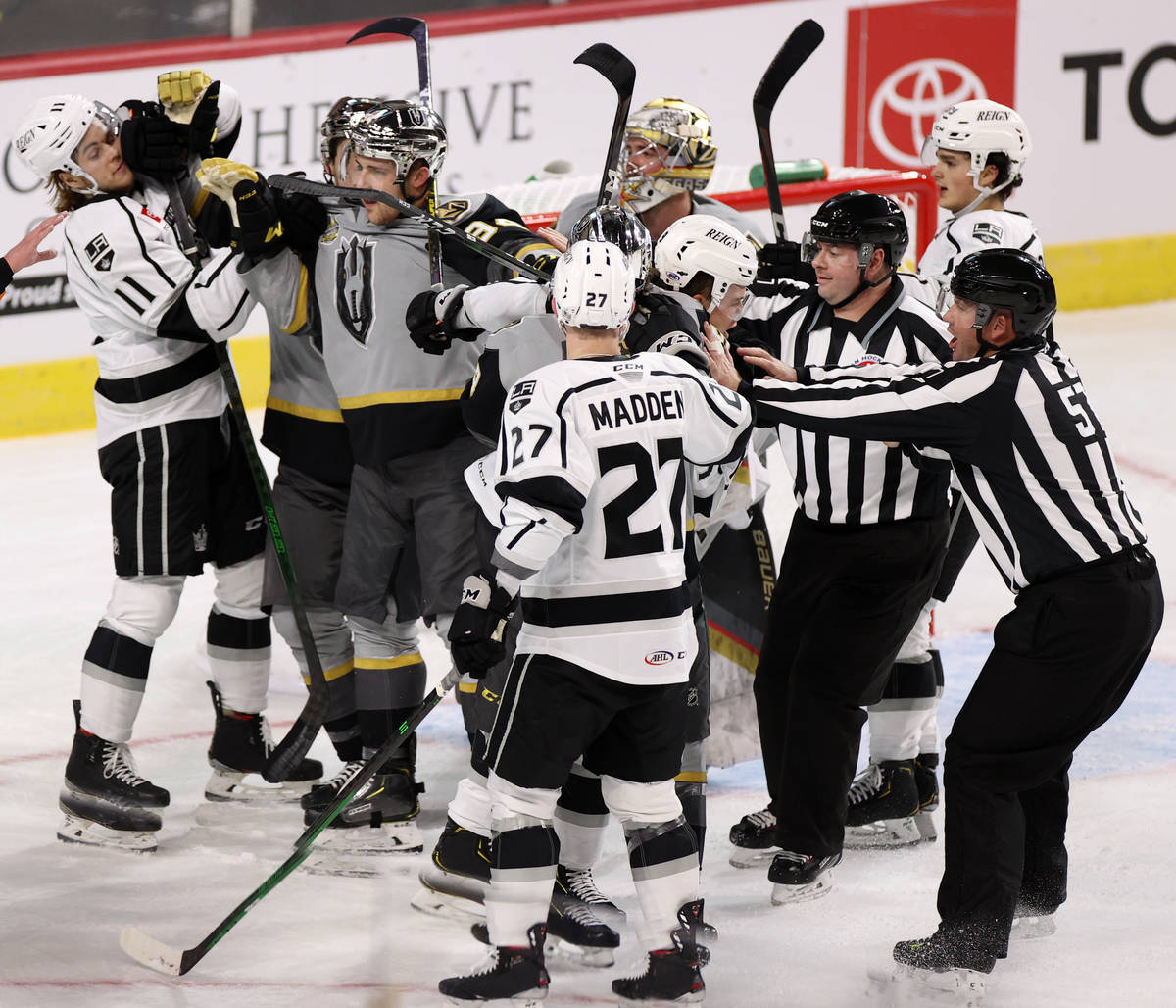 Henderson Silver Knights and Ontario Reign players get physical during the first period of an A ...