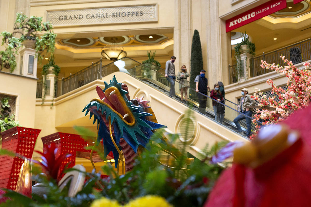 Visitors to The Venetian pass an installation for Lunar New Year on Friday, Feb. 5, 2021, in La ...