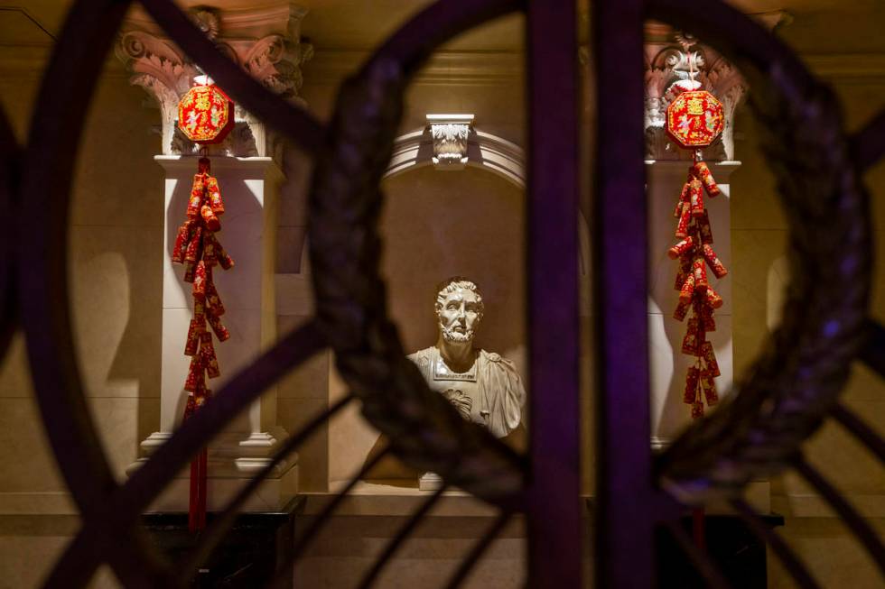 Fireworks and good luck symbols are hung as part of the decorations for the Lunar New Year thro ...