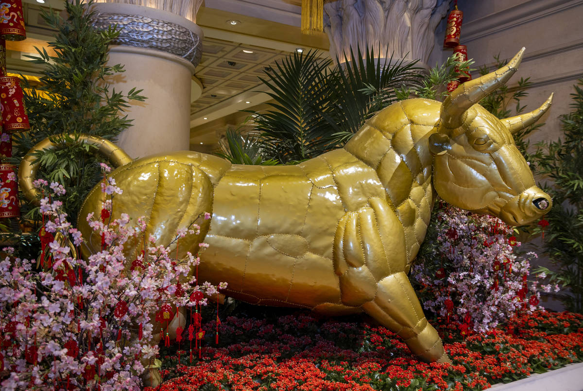 A golden ox as part of the decorations for the Lunar New Year near the casino at Caesars Palace ...