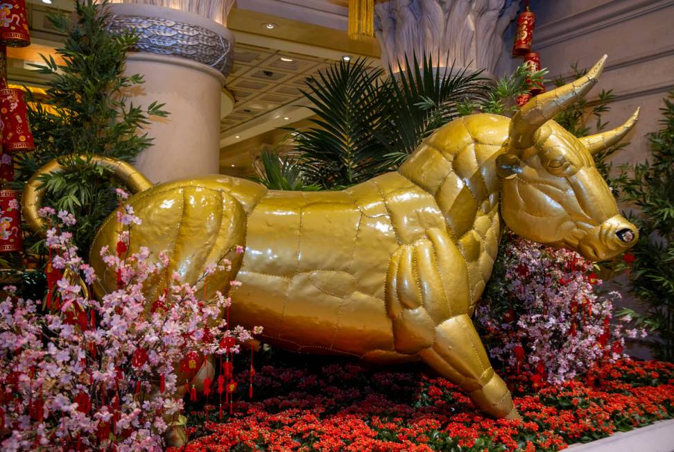 A golden ox as part of the decorations for the Lunar New Year near the casino at Caesars Palace ...