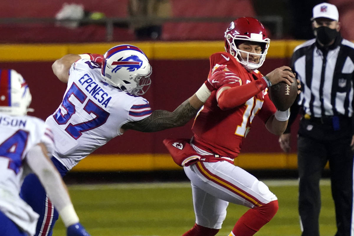 Kansas City Chiefs quarterback Patrick Mahomes is pressured by Buffalo Bills defensive end AJ E ...