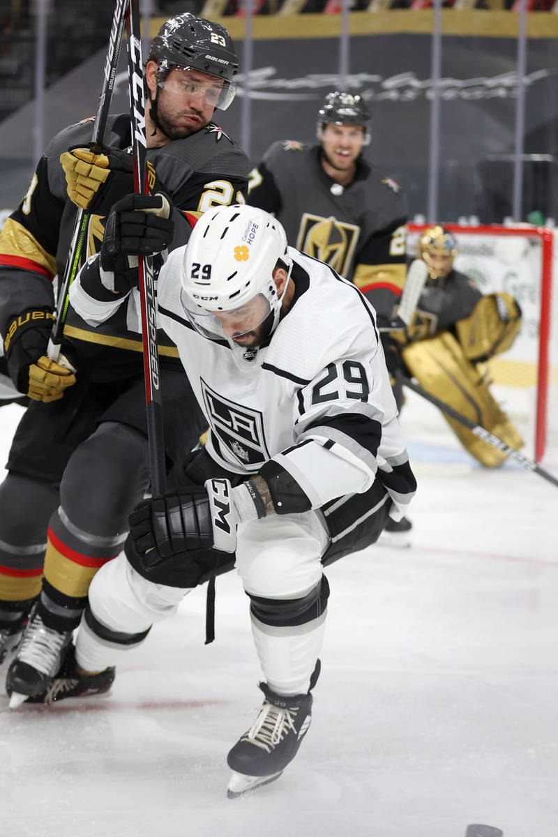 Vegas Golden Knights defenseman Alec Martinez (23) defends against Los Angeles Kings right wing ...