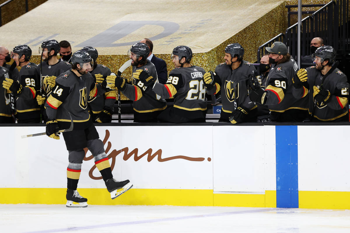 Vegas Golden Knights defenseman Nicolas Hague (14) celebrates a goal with his team during the f ...