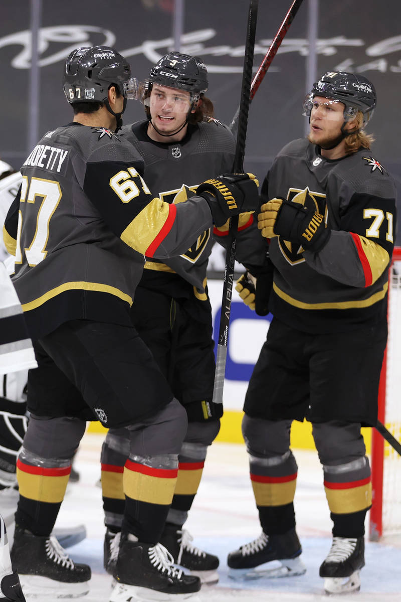 Vegas Golden Knights Cody Glass (9) celebrates his score with left wing Max Pacioretty (67) and ...