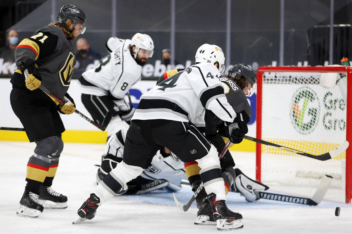Vegas Golden Knights Cody Glass (9) goes for a shot and a goal under pressure from Los Angeles ...