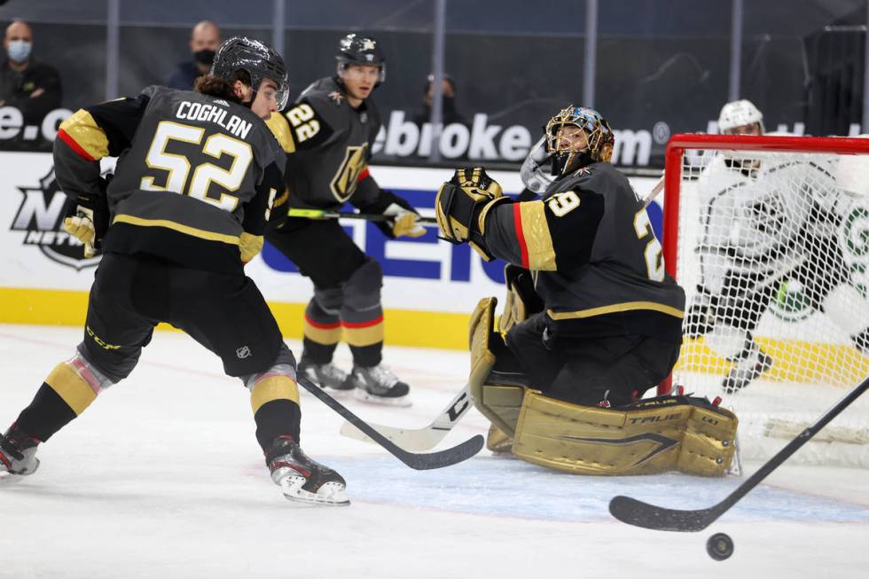 Vegas Golden Knights goaltender Marc-Andre Fleury (29) and defenseman Dylan Coghlan (52) defend ...