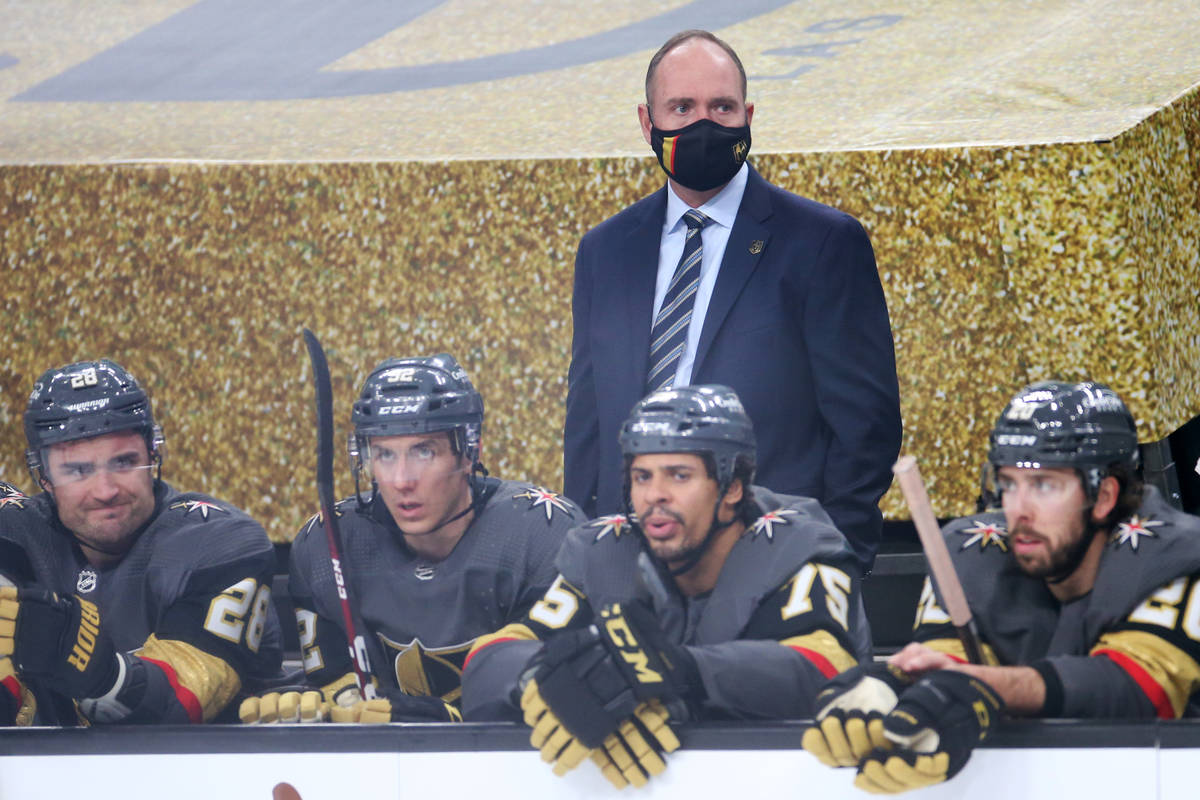 Vegas Golden Knights head coach Peter DeBoer, center, during the second period of an NHL hockey ...