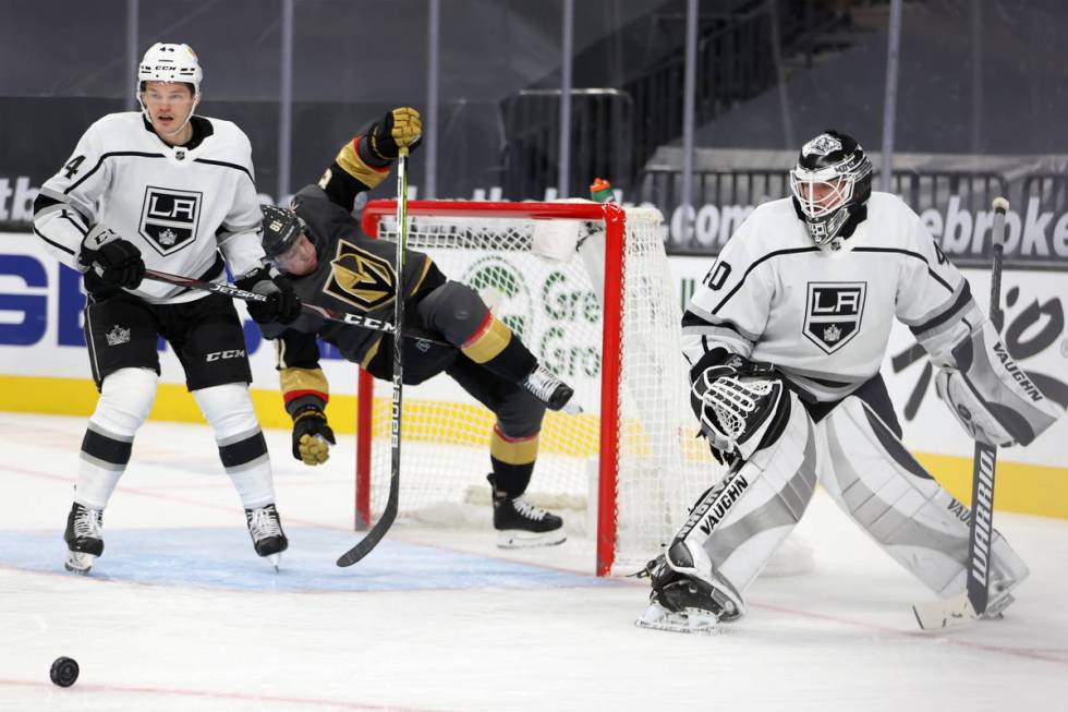 Vegas Golden Knights center Jonathan Marchessault (81) takes a fall going for the puck against ...