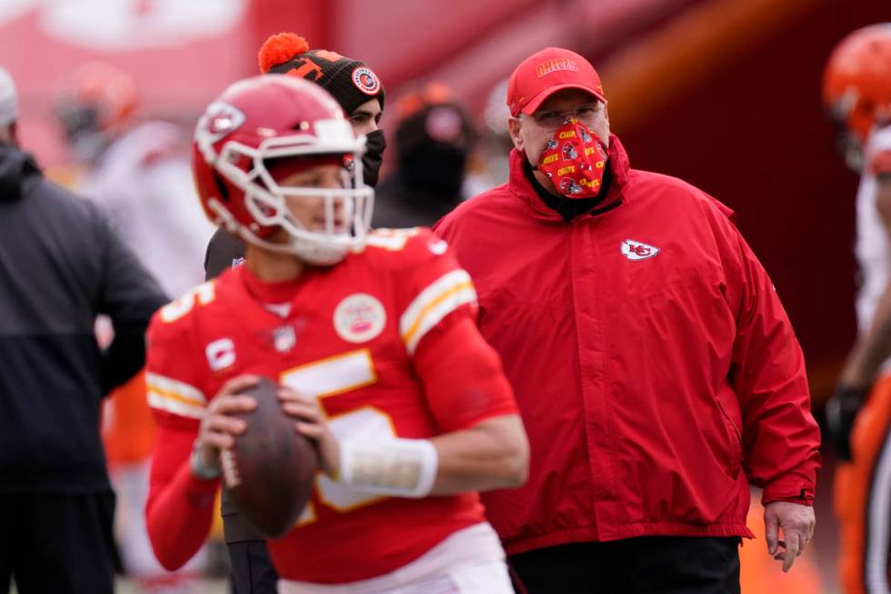 In this Sunday, Jan. 17, 2021, file photo, Kansas City Chiefs head coach Andy Reid, right, watc ...