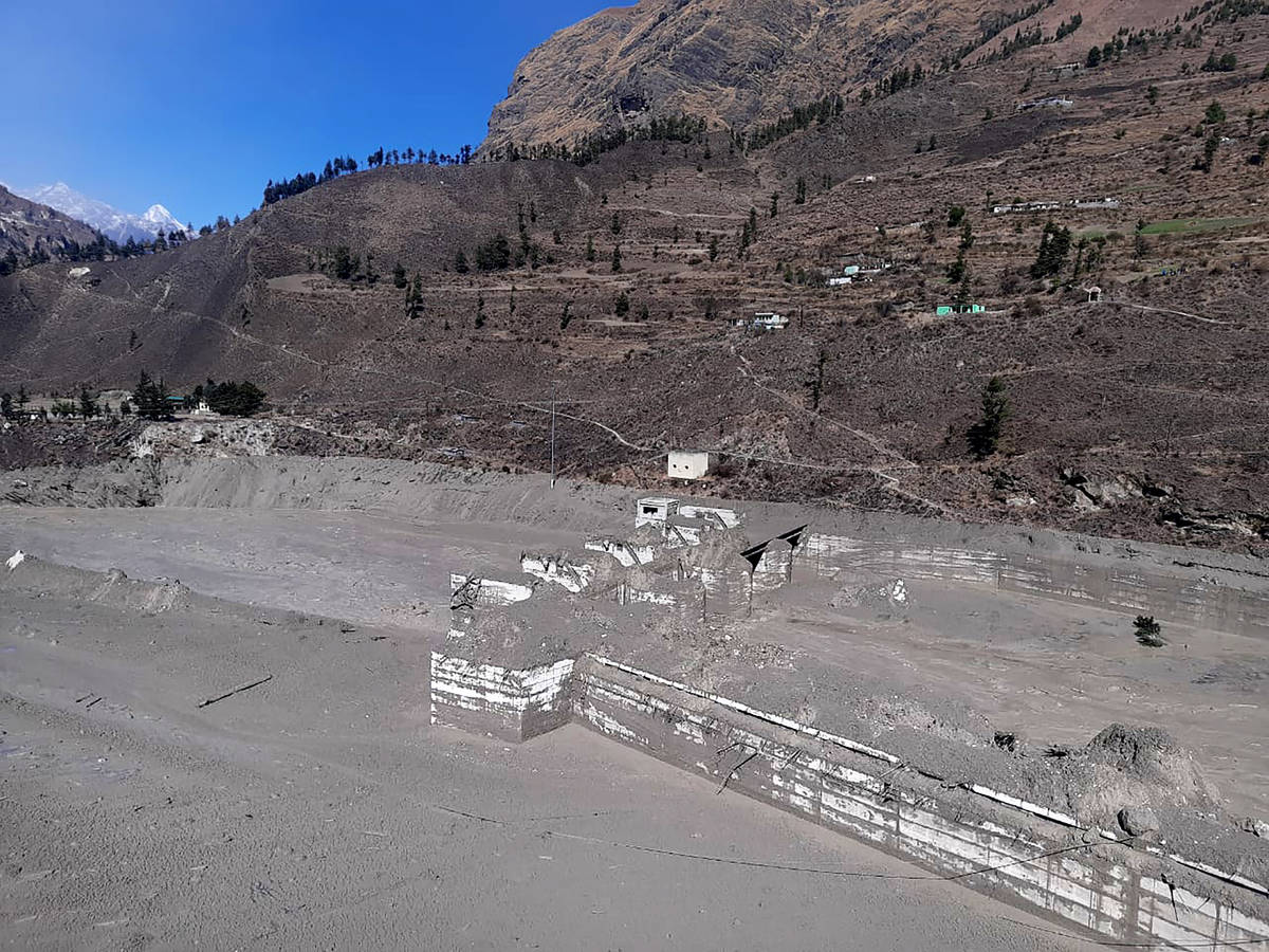 A view of the damaged Dhauliganga hydropower project at Reni village in Chamoli district after ...