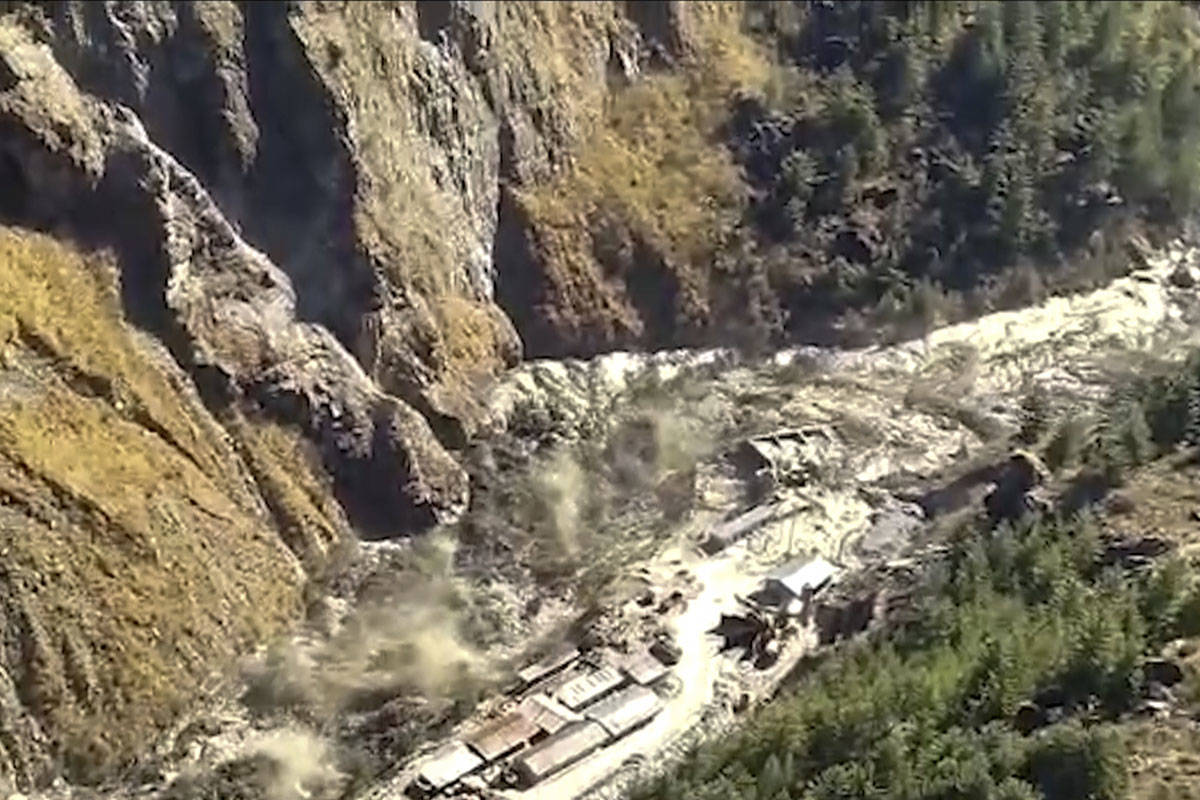 This frame grab from video provided by KK Productions shows a massive flood of water, mud and d ...