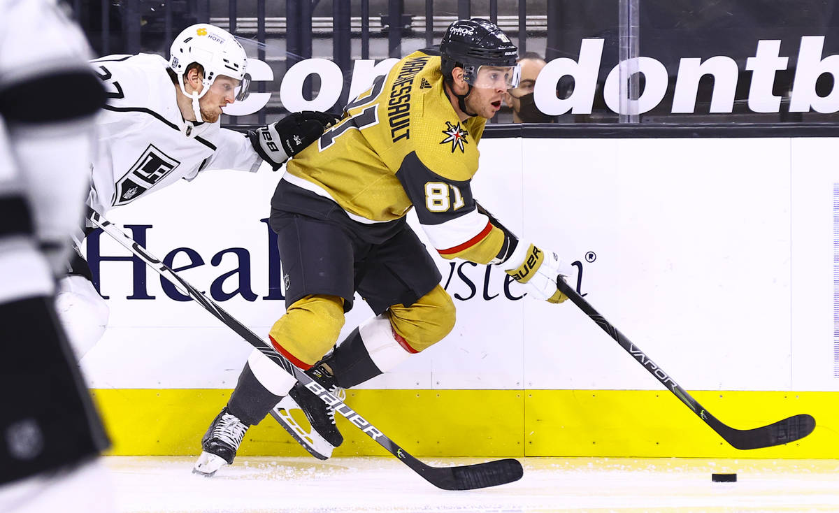 Golden Knights center Jonathan Marchessault (81) skates with the puck under pressure from Los A ...