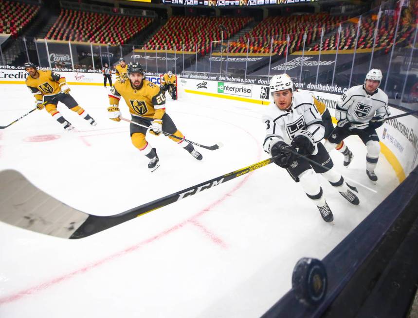 Los Angeles Kings center Gabriel Vilardi (13) chases after the puck as Golden Knights center Ch ...