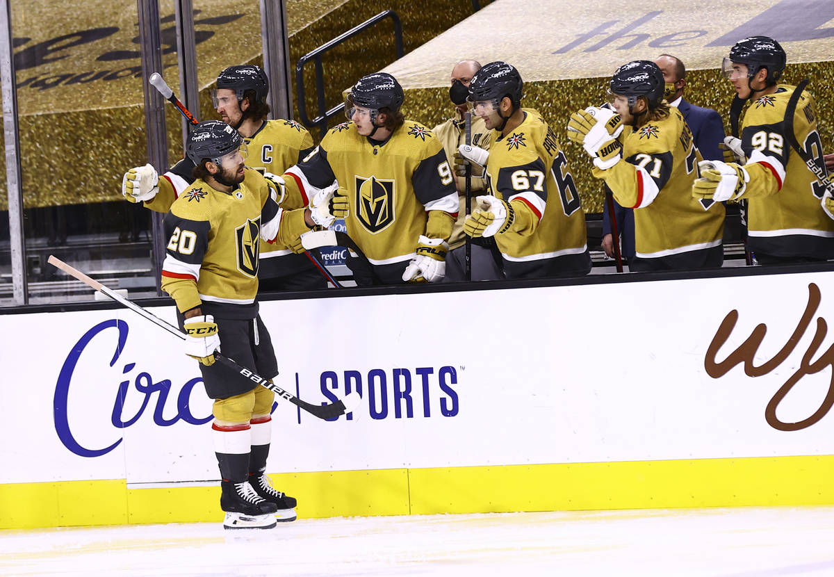 Golden Knights center Chandler Stephenson (20) celebrates his second goal of the game with team ...