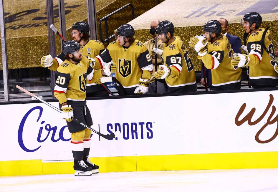 Golden Knights center Chandler Stephenson (20) celebrates his second goal of the game with team ...