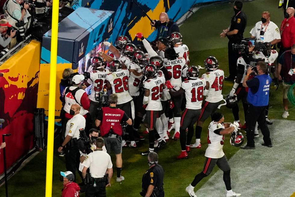 The Tampa Bay Buccaneers defense celebrates an interception during the second half of the NFL S ...