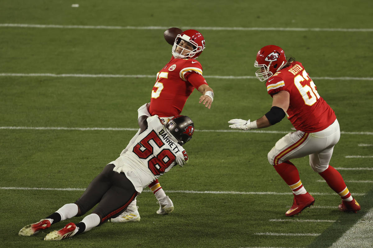 Kansas City Chiefs quarterback Patrick Mahomes (15) is hit by Tampa Bay Buccaneers' Shaquil Bar ...