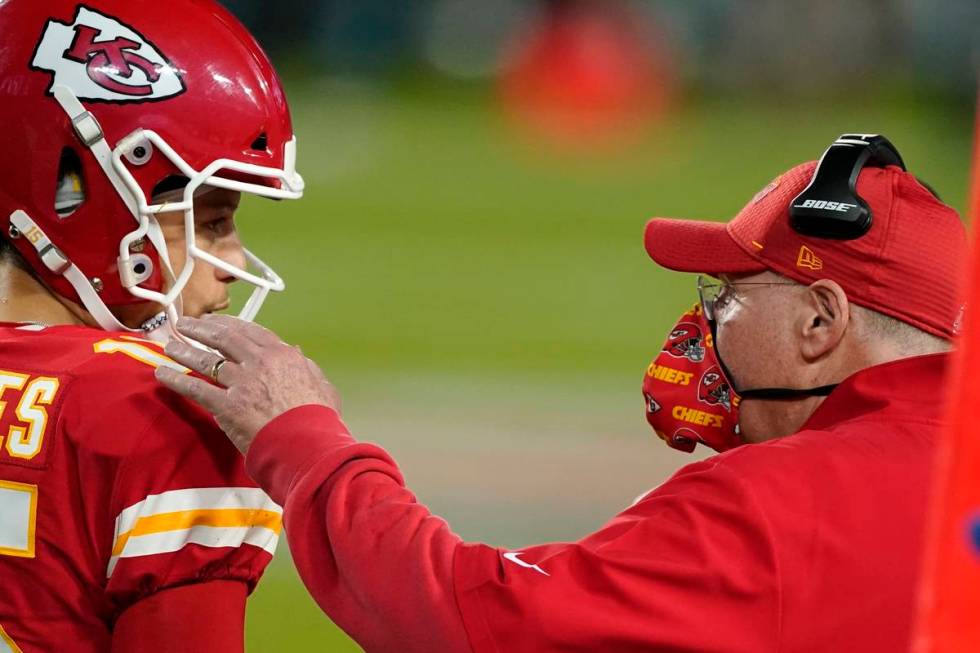 Kansas City Chiefs head coach Andy Reid, right, talks with quarterback Patrick Mahomes during t ...