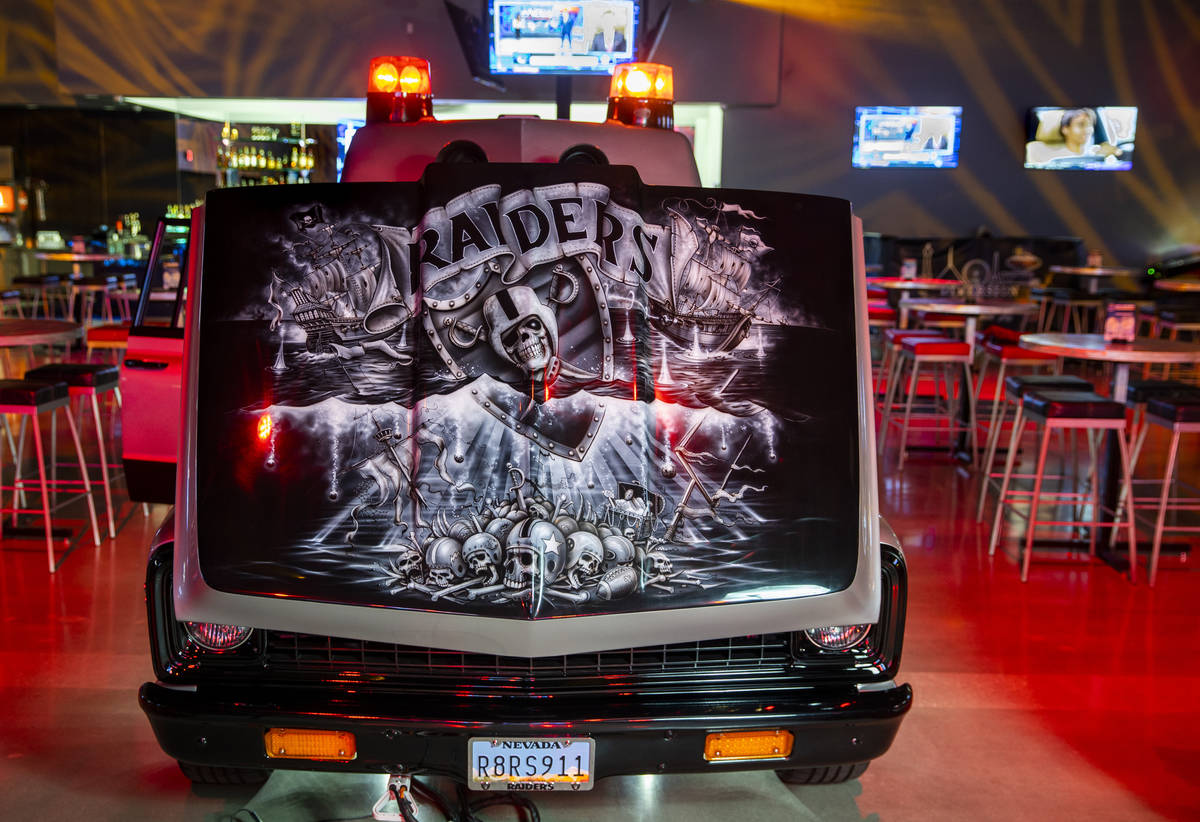 Custom painted hood by artist Craig Fraser on the Raiders Ambulance which is a tricked-out, dec ...