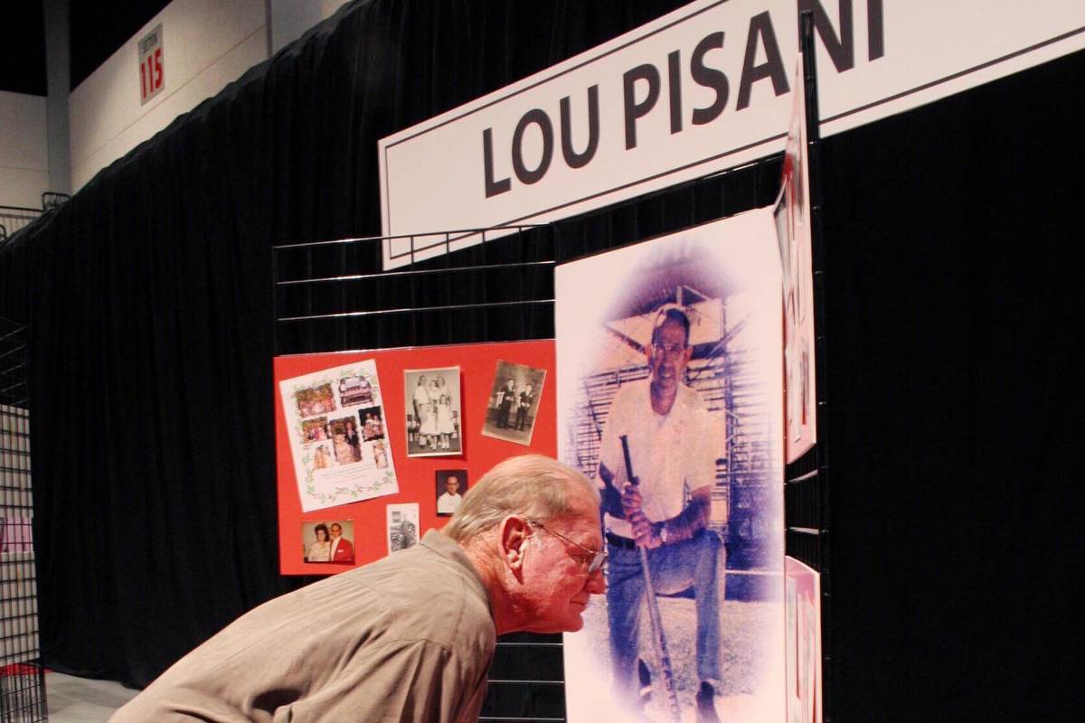 SPORTS Rick Traasdahl looks at a collection of baseball memorabilia from Lou Pisani at the Sout ...