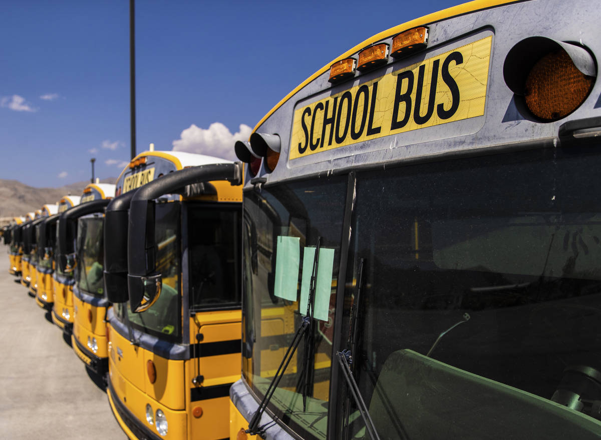 Rows of busses lay dormant at Northwest Transportation Facility on Thursday, Aug. 20, 2020, in ...