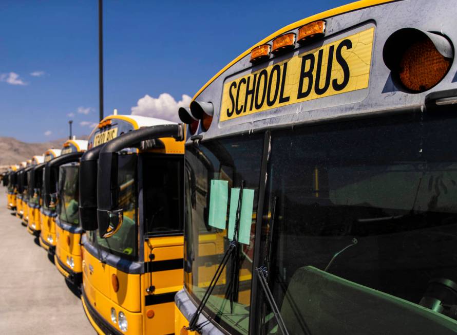 Rows of busses lay dormant at Northwest Transportation Facility on Thursday, Aug. 20, 2020, in ...