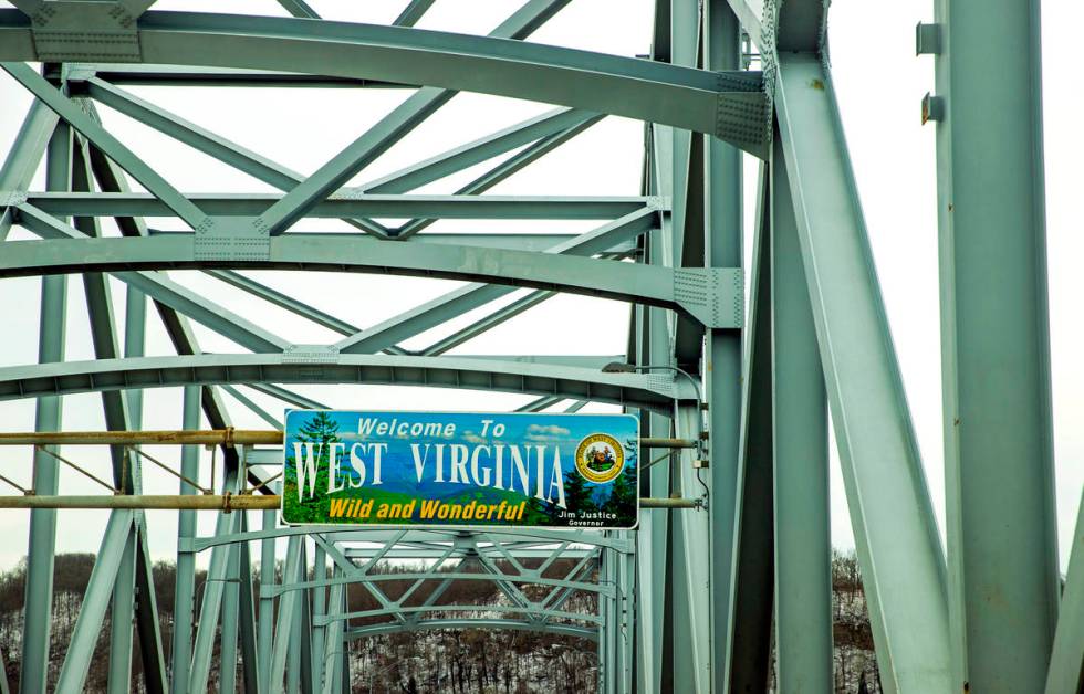A "Welcome to West Virginia" sign greets those crossing the bridge over the Ohio Rive ...