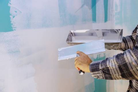 Nail pops can cause dimpling in drywall. Smoothing out the surface of the wall will not fix the ...