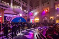 The 65-member Macau Youth Orchestra performs at the opening ceremony for the Londoner, Las Vega ...