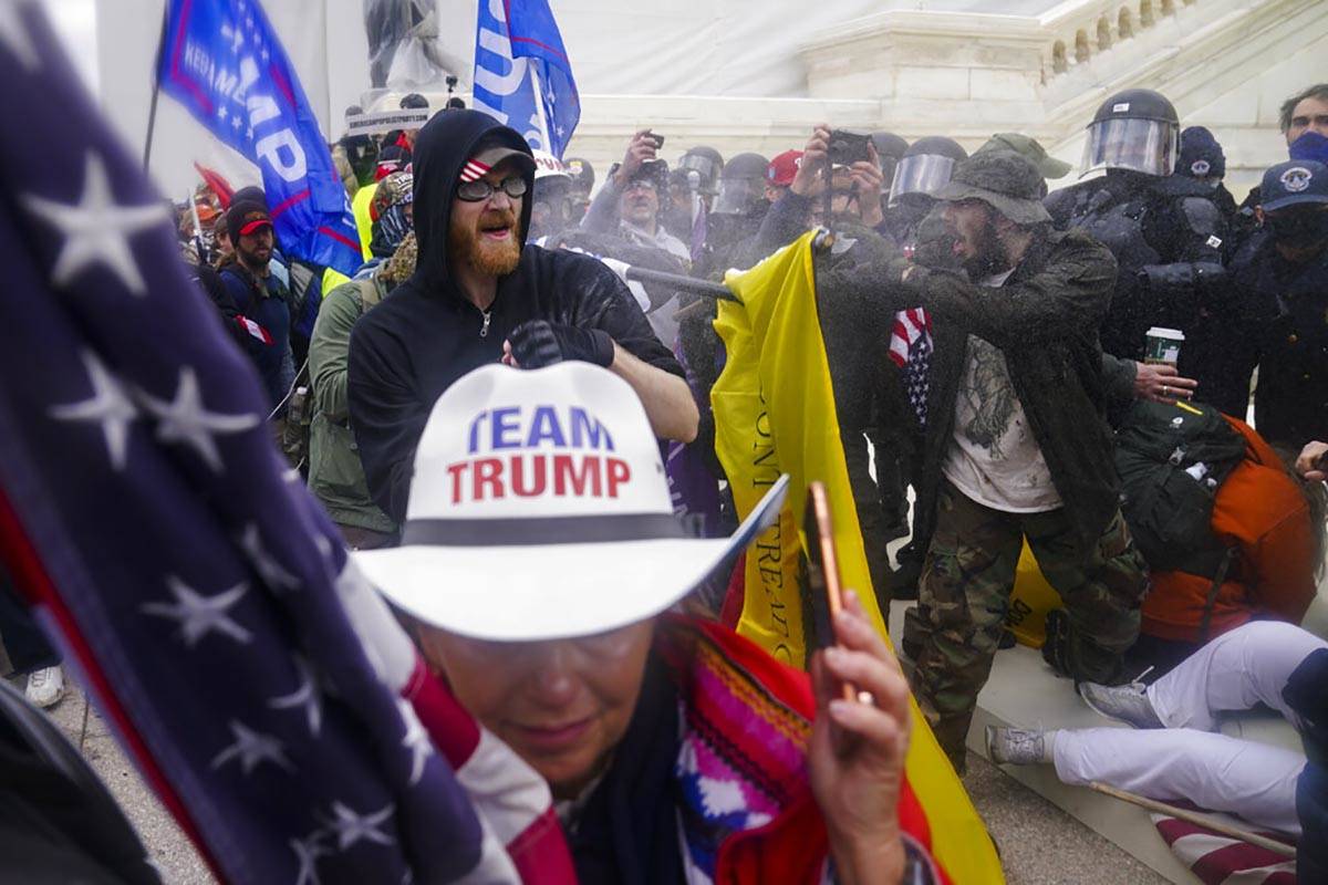 FILE - In this Jan. 6, 2021, file photo rioters loyal to President Donald Trump try to break th ...