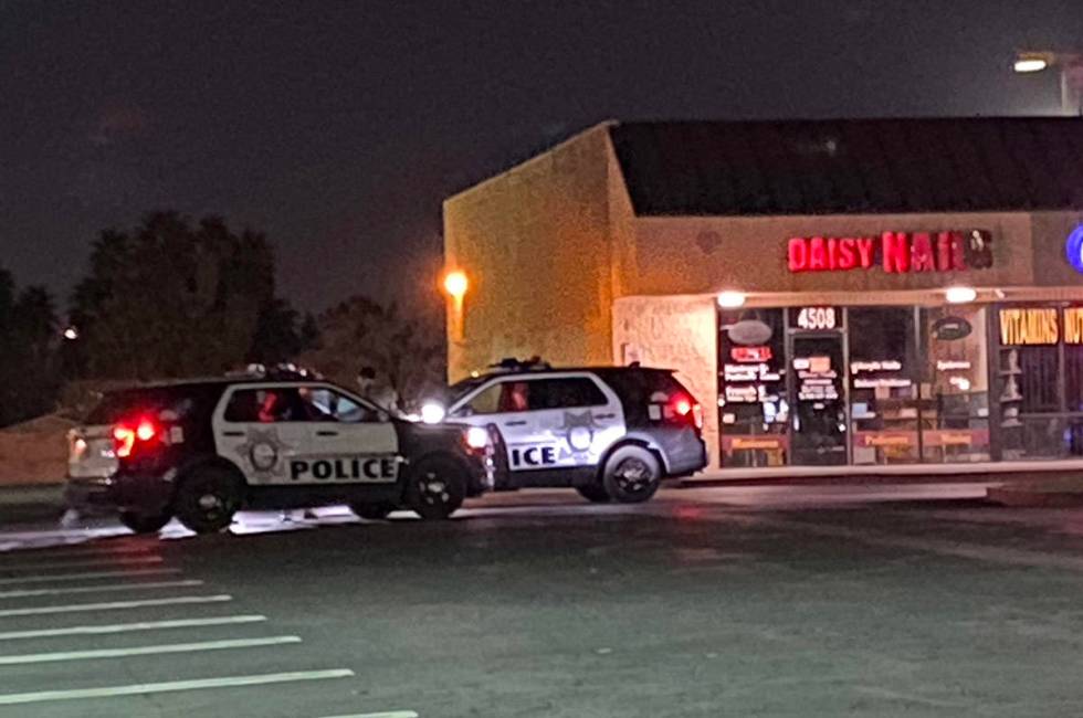 Las Vegas police at a strip mall at East Charleston and Lamb boulevards as they investigate abo ...