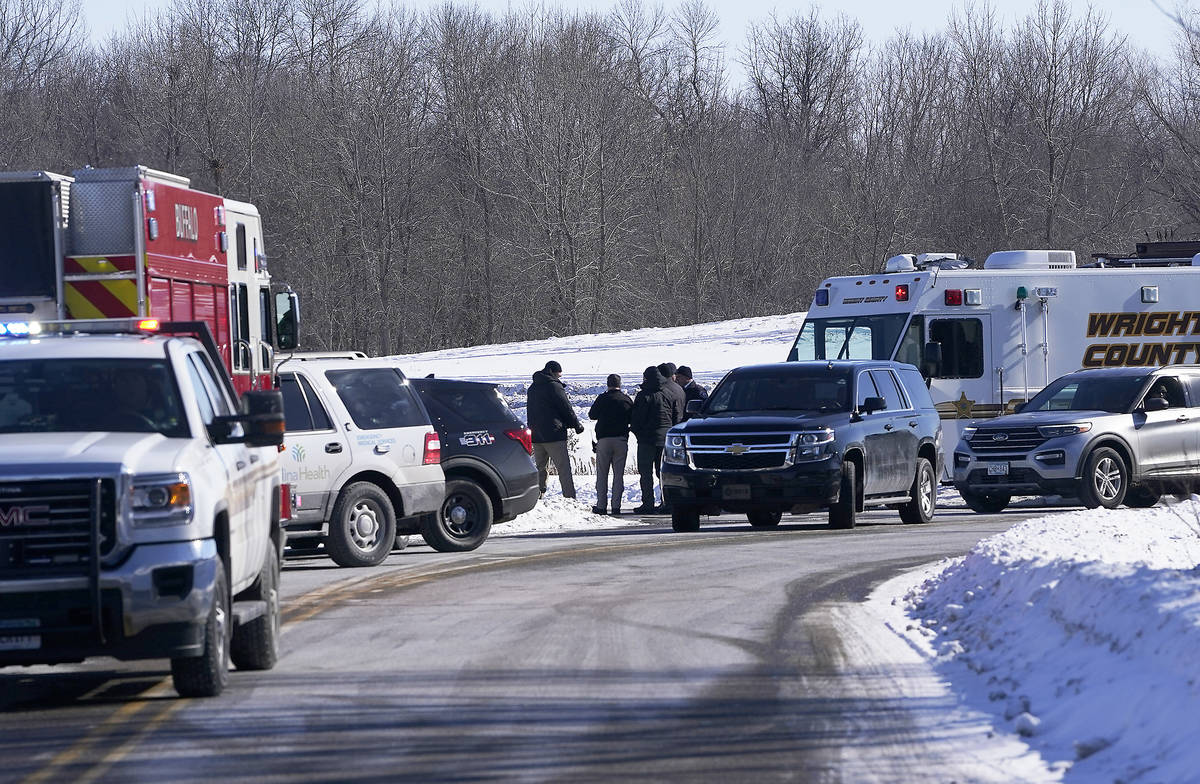 Law enforcement personnel and first responders gather outside of the Allina Health clinic, Tues ...