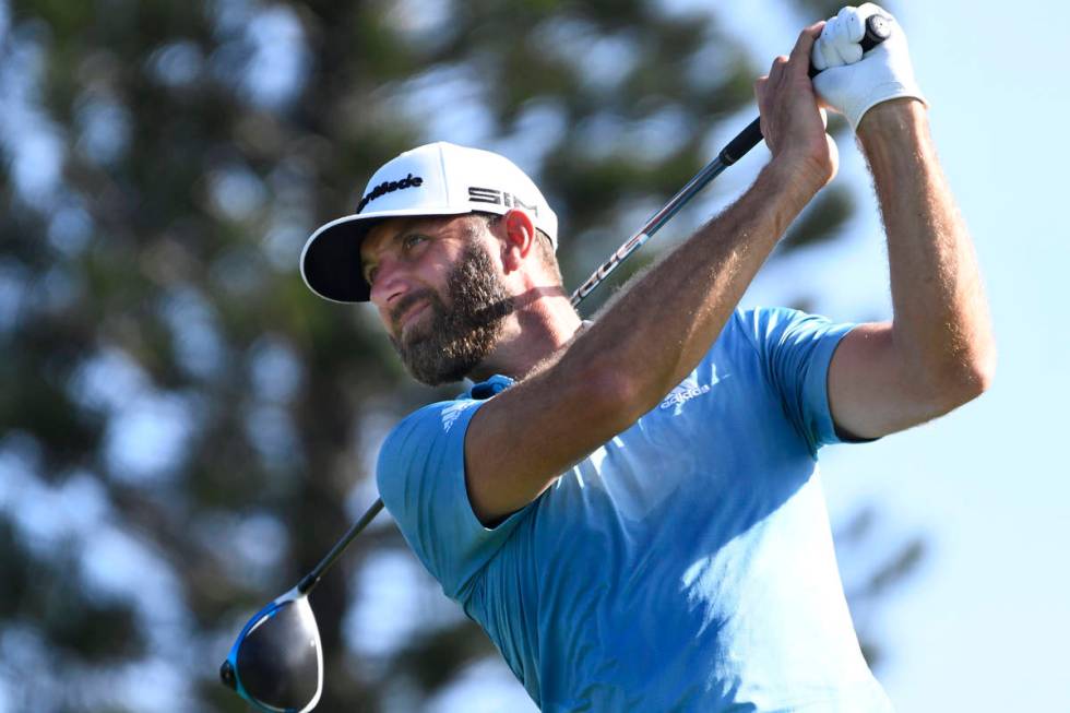 Dustin Johnson watches a shot during the second round of the Tournament of Champions golf event ...