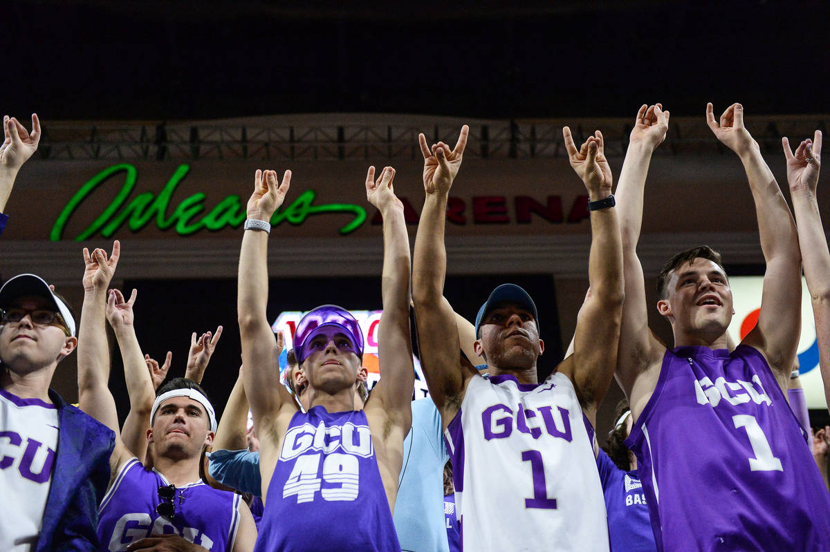 Fans in the Grand Canyon University student section "put their lopes up" to cheer on ...