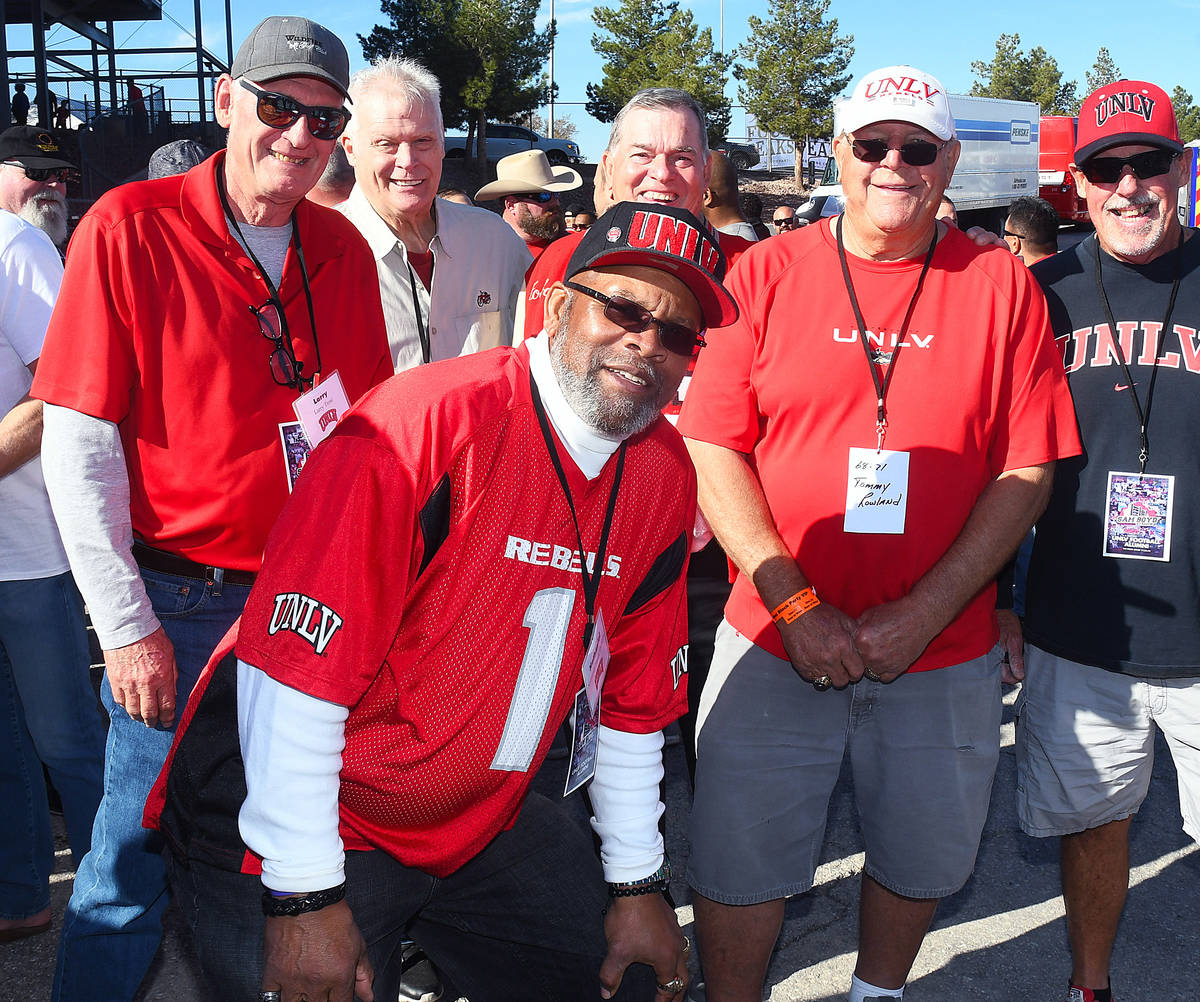 Former UNLV wide receiver Nate Hawkins poses for a photo with his teammates from the 1968 team. ...