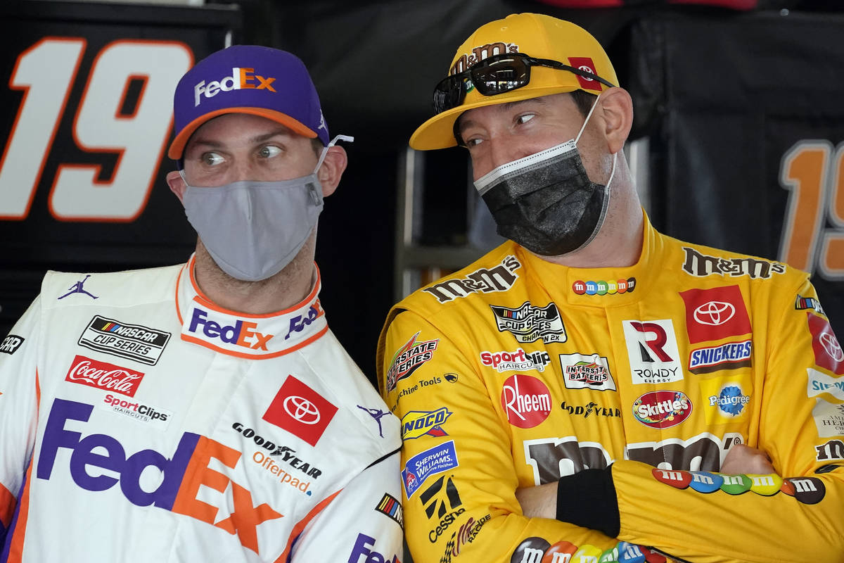 Denny Hamlin, left, and Kyle Busch joke around in the garages during a NASCAR Daytona 500 auto ...