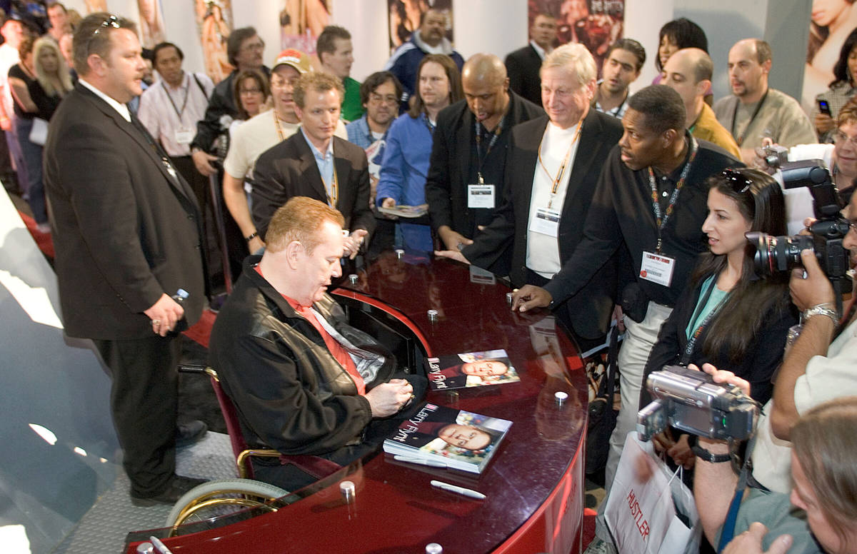 In this 2007 file photo, Hustler magazine publisher Larry Flynt signs autographs during the Adu ...