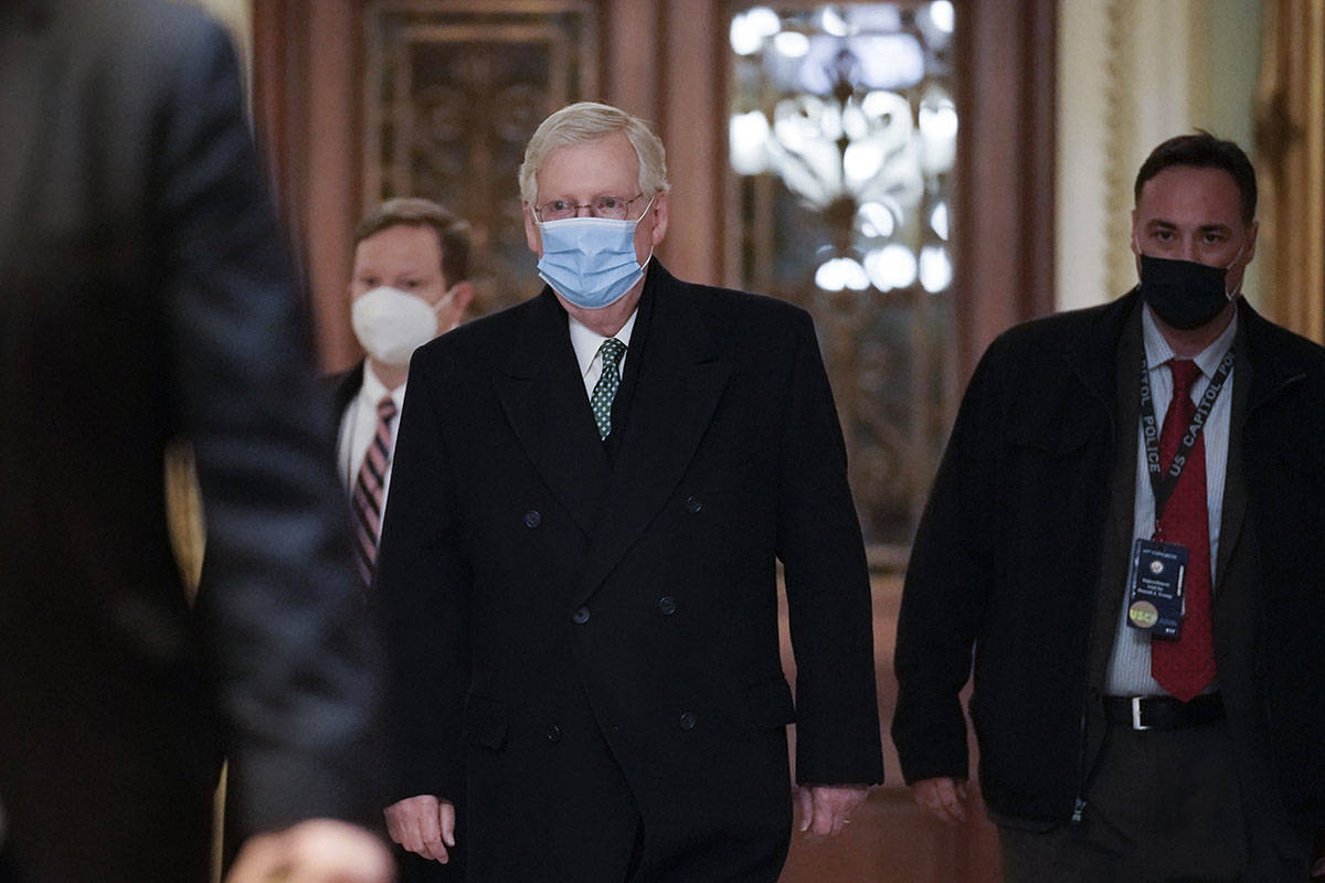 Senate Minority Leader Mitch McConnell, R-Ky., arrives at the Capitol in Washington, Thursday, ...