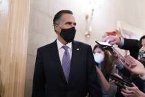 Reporters vie for a response from Sen. Mitt Romney, R-Utah, as Senators take a dinner break whi ...